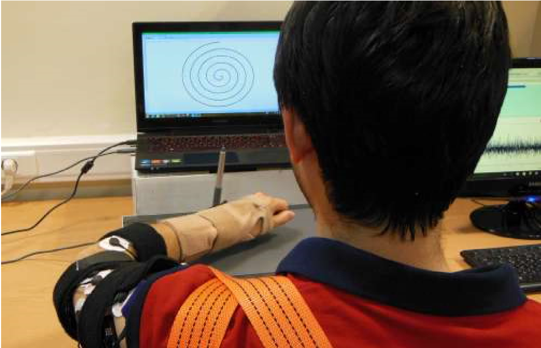Person performing spiral tracking task with EMG sensors